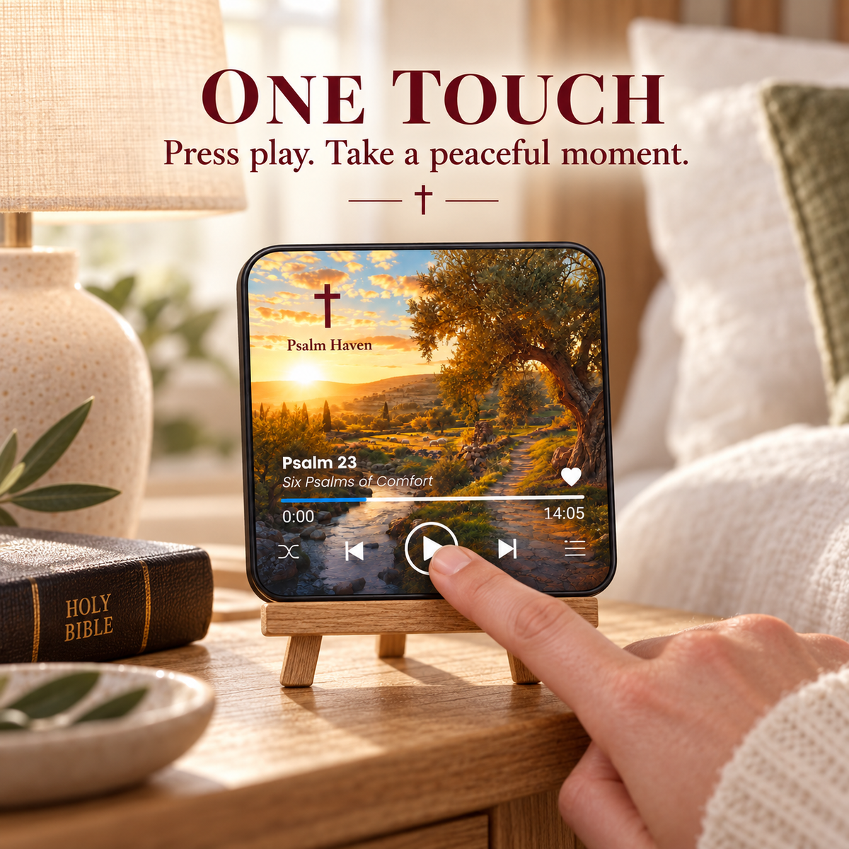 A finger pressing the play button on the Psalm 23 Audio Magnet