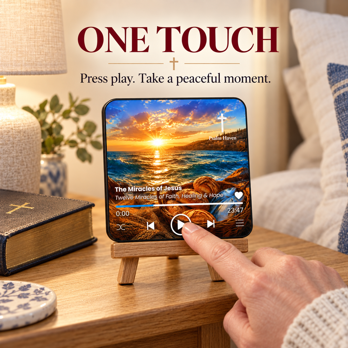 A finger pressing the play button on The Miracles of Jesus Audio Magnet