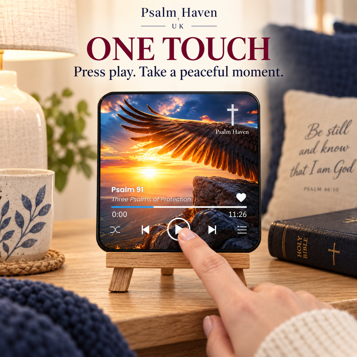 A finger pressing the play button on the Psalm 91 Audio Magnet